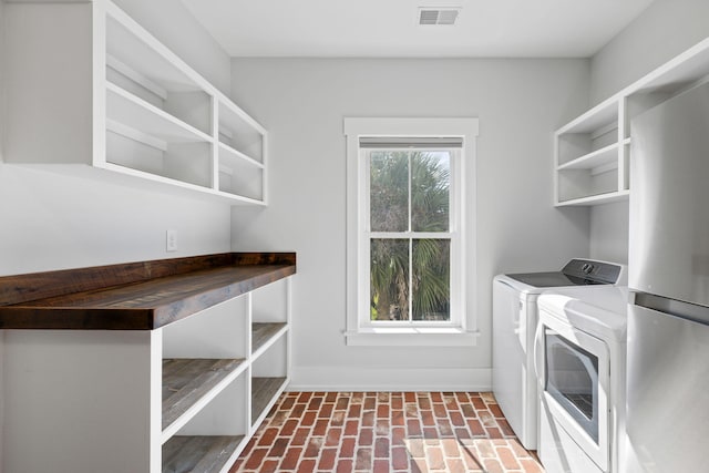 laundry room featuring washer and dryer