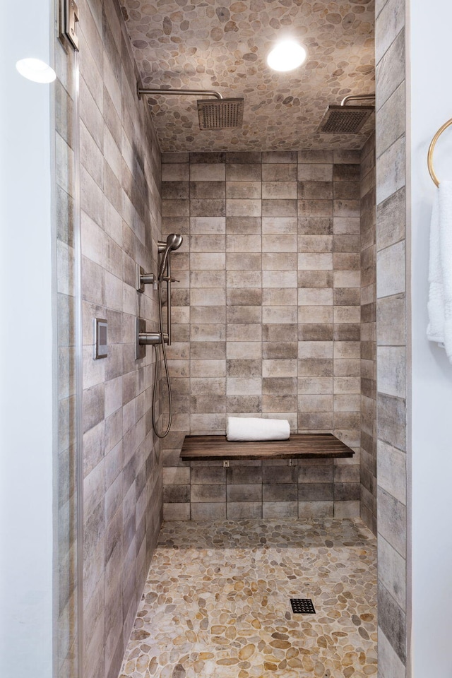 bathroom with a tile shower