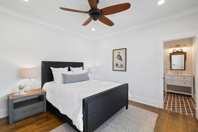 bedroom with ceiling fan, ornamental molding, ensuite bath, and dark hardwood / wood-style floors