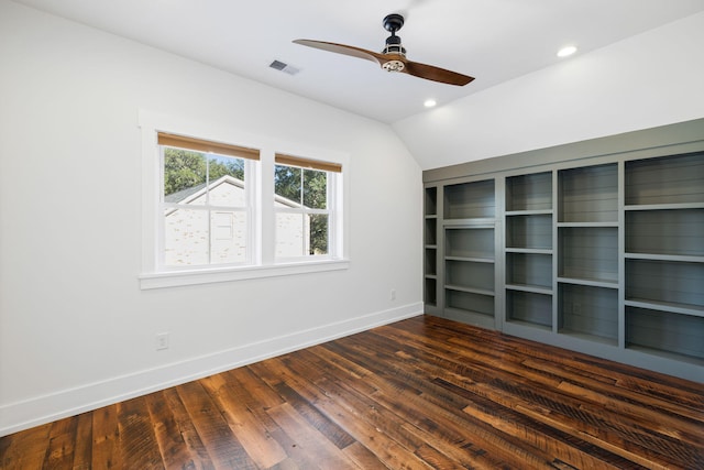 unfurnished bedroom featuring ceiling fan, vaulted ceiling, a closet, and dark hardwood / wood-style flooring