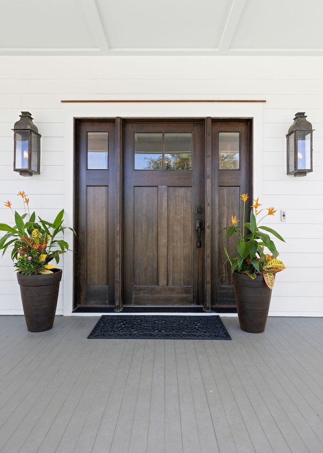 property entrance with a wooden deck