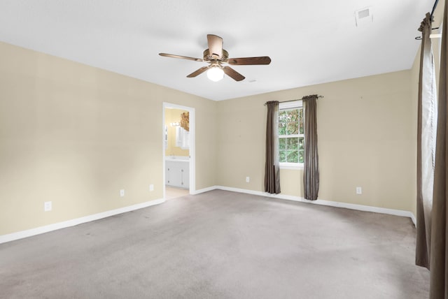 empty room with ceiling fan and carpet flooring