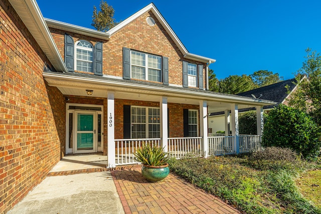 entrance to property with a porch