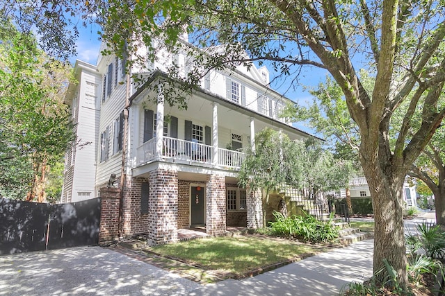 view of front of house featuring a balcony