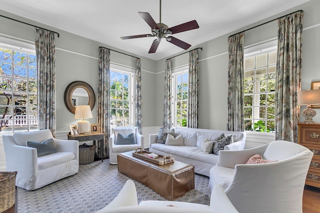 living room featuring ceiling fan, ornamental molding, plenty of natural light, and hardwood / wood-style floors