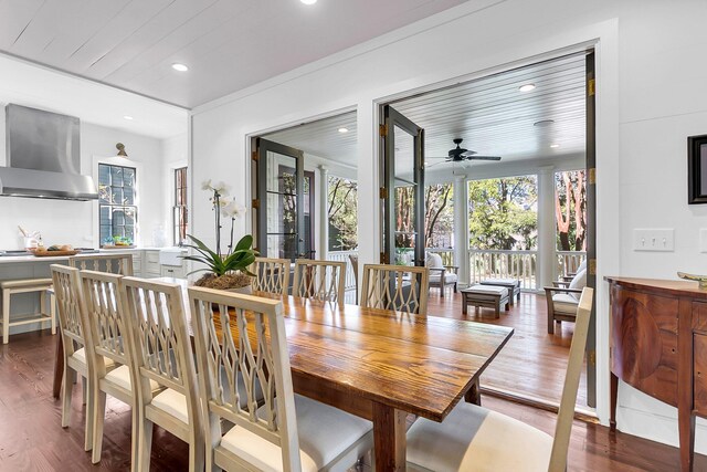 dining area with ceiling fan, wood-type flooring, wood ceiling, and plenty of natural light