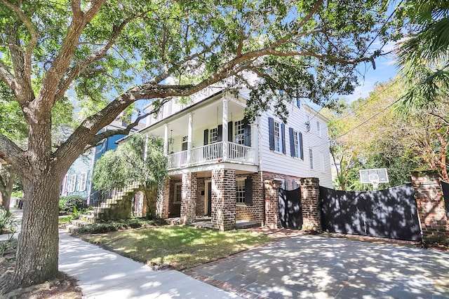 view of front of house featuring a balcony