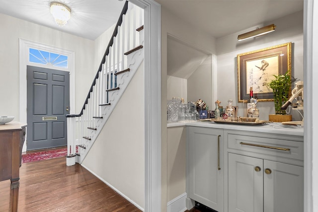 entryway with dark hardwood / wood-style floors