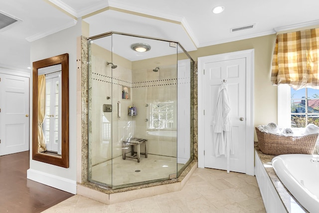 bathroom with ornamental molding, tile patterned floors, and separate shower and tub