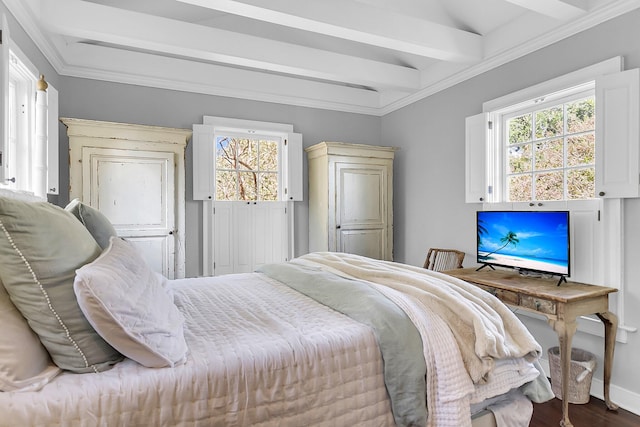 bedroom with multiple windows, ornamental molding, hardwood / wood-style flooring, and beamed ceiling