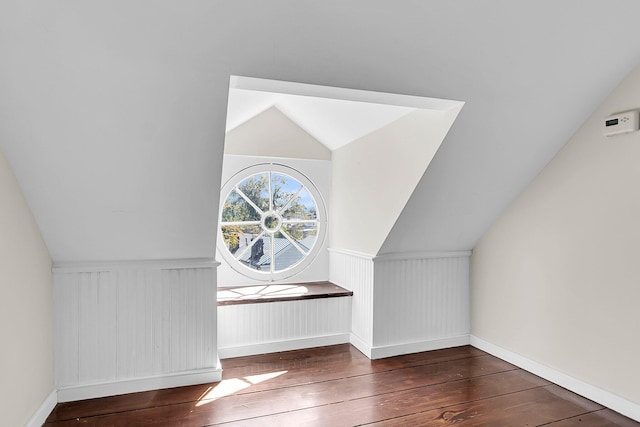 bonus room featuring lofted ceiling and dark hardwood / wood-style floors