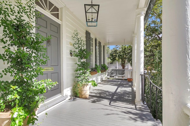 wooden terrace featuring a porch