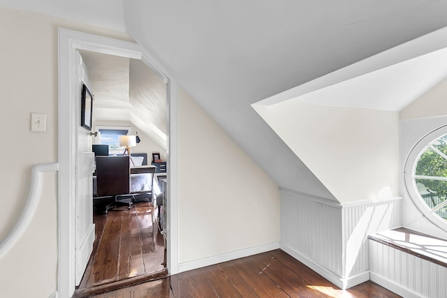 bonus room with vaulted ceiling and dark hardwood / wood-style flooring