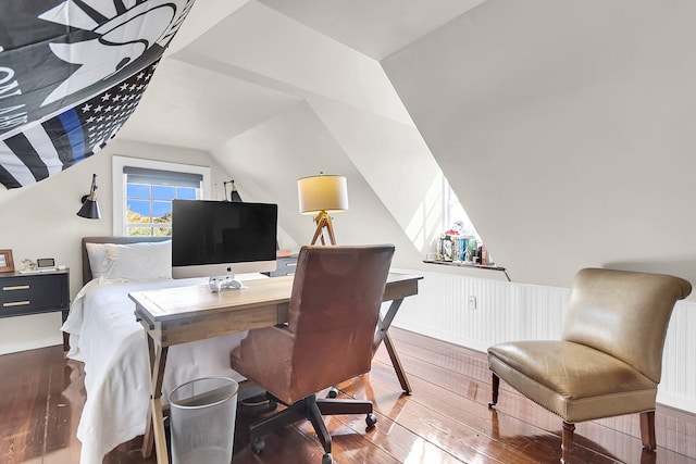 home office featuring dark wood-type flooring and vaulted ceiling