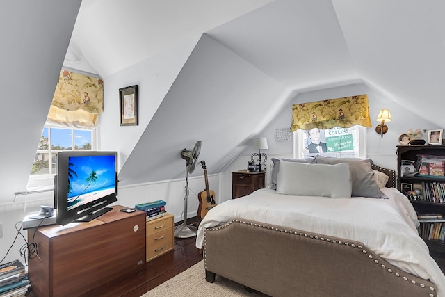 bedroom with hardwood / wood-style floors and vaulted ceiling