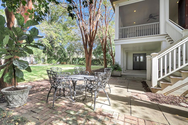 view of patio featuring ceiling fan