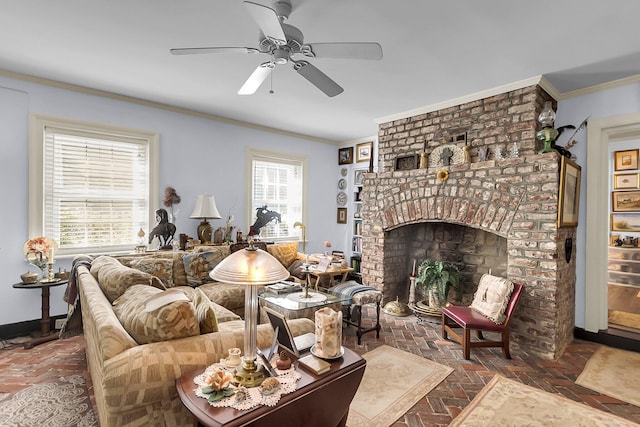 living room with ceiling fan, ornamental molding, a wealth of natural light, and a fireplace