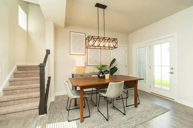 dining space featuring wood-type flooring