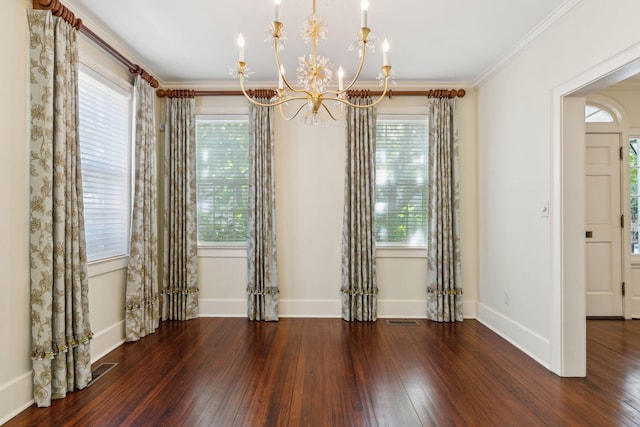 unfurnished room with crown molding, dark wood-type flooring, and a wealth of natural light