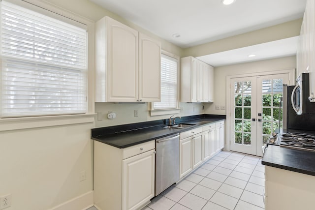 kitchen featuring white cabinets, dishwasher, sink, and french doors