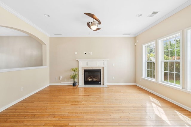 489 Dolphin Dr, Summerville, SC 29485 - unfurnished living room with a ceiling fan, crown molding, light wood-style floors, a high end fireplace, and baseboards