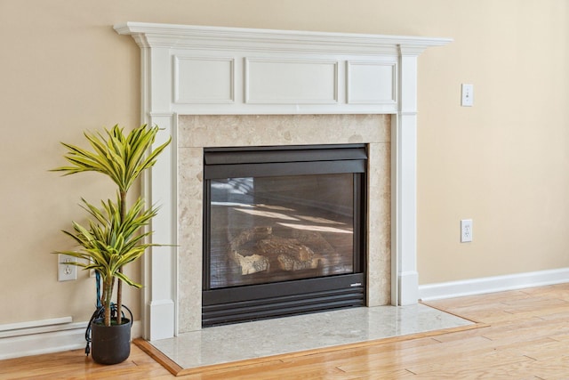 489 Dolphin Dr, Summerville, SC 29485 - detailed view of a premium fireplace, wood finished floors, and baseboards