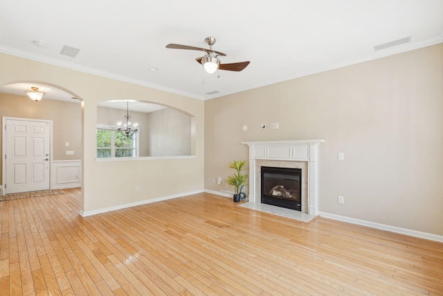 489 Dolphin Dr, Summerville, SC 29485 - unfurnished living room featuring a ceiling fan, light wood-style flooring, crown molding, baseboards, and a premium fireplace