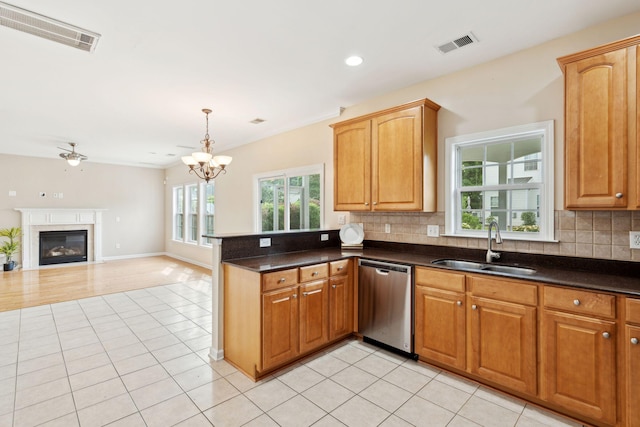 489 Dolphin Dr, Summerville, SC 29485 - kitchen featuring dishwasher, a sink, light tile patterned flooring, decorative backsplash, and recessed lighting