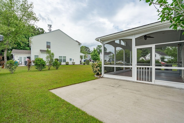489 Dolphin Dr, Summerville, SC 29485 - view of green lawn with a sunroom, ceiling fan, and a patio