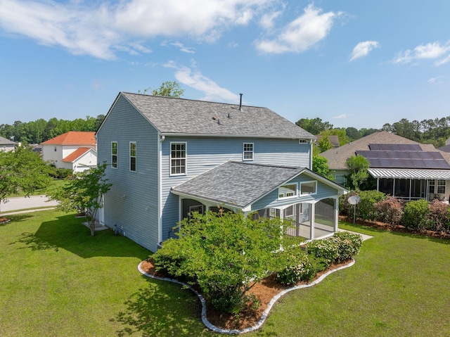 489 Dolphin Dr, Summerville, SC 29485 - back of house with a sunroom, a lawn, and a shingled roof