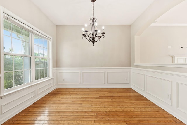 489 Dolphin Dr, Summerville, SC 29485 - unfurnished dining area with a chandelier, wainscoting, and light wood-style floors