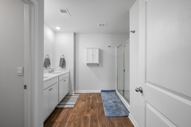 671 Silver Spruce St, Summerville, SC 29486 - bathroom with vanity, wood finished floors, a shower stall, and baseboards