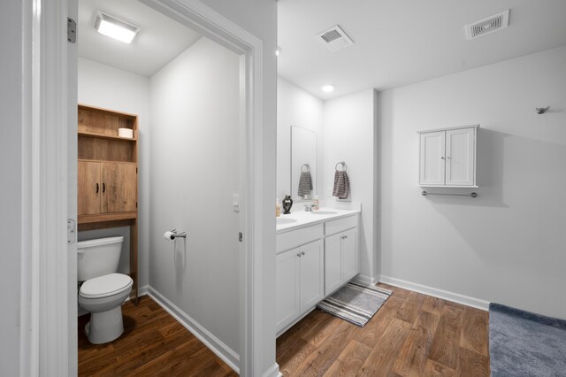 671 Silver Spruce St, Summerville, SC 29486 - bathroom featuring toilet, vanity, wood finished floors, and baseboards