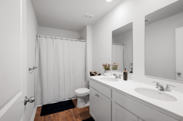 671 Silver Spruce St, Summerville, SC 29486 - full bath featuring double vanity, toilet, wood finished floors, and shower / bath combination with curtain