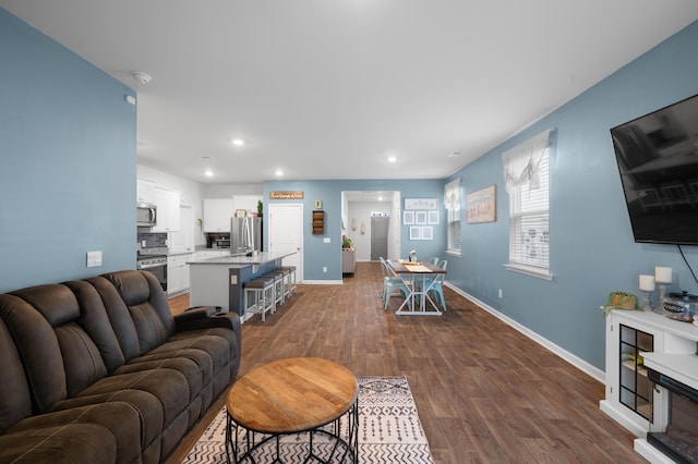 671 Silver Spruce St, Summerville, SC 29486 - living room featuring dark wood-type flooring, baseboards, and recessed lighting