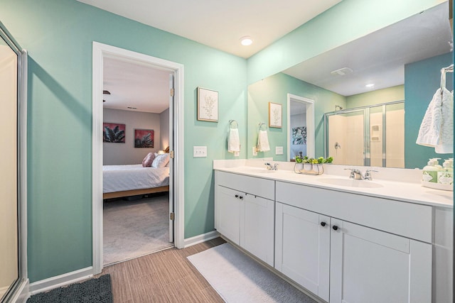 bathroom with walk in shower and vanity