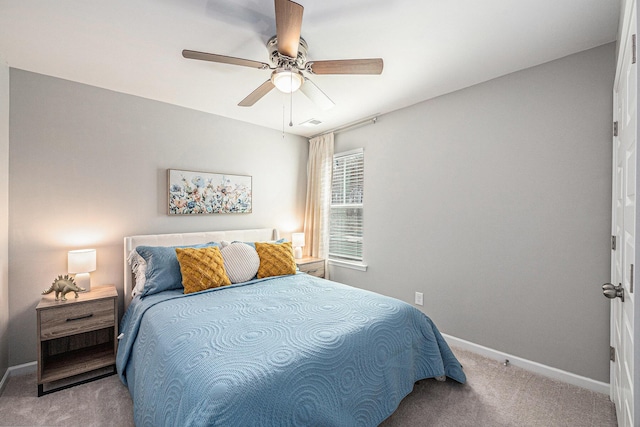 bedroom featuring ceiling fan and light carpet