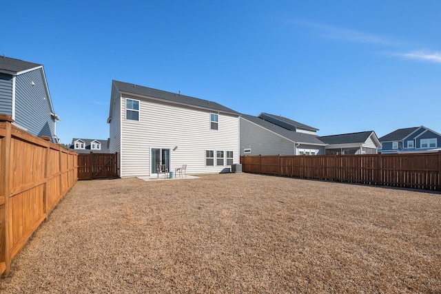 back of property featuring a patio area, central AC unit, and a lawn