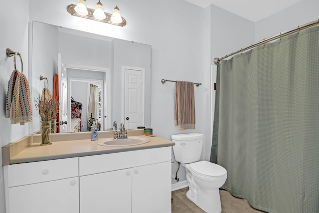 bathroom featuring tile patterned floors, walk in shower, vanity, and toilet