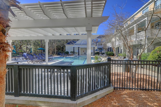 view of swimming pool with a pergola