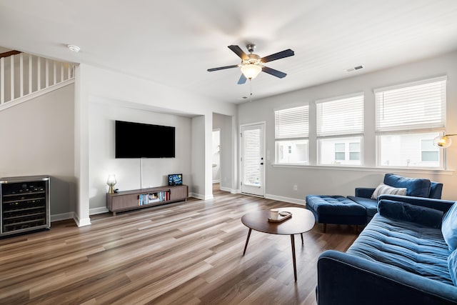 582 Mclernon Trce, Johns Island, SC 29455 - living room with wine cooler, ceiling fan, wood finished floors, and baseboards