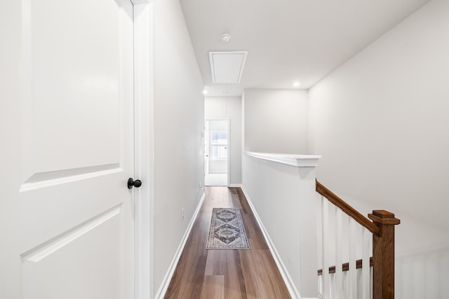 582 Mclernon Trce, Johns Island, SC 29455 - hallway featuring attic access, wood finished floors, and an upstairs landing