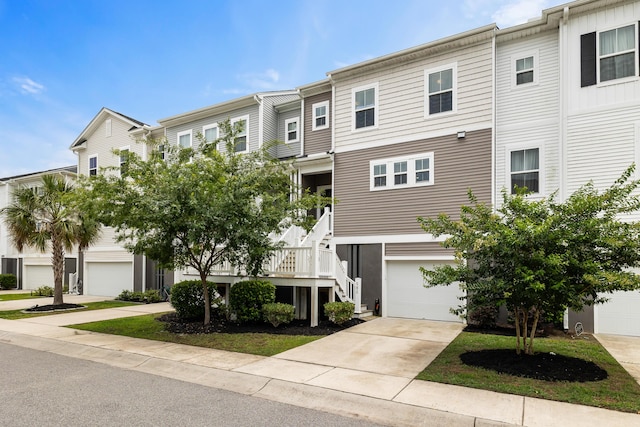 582 Mclernon Trce, Johns Island, SC 29455 - view of building exterior with a garage, driveway, and stairs