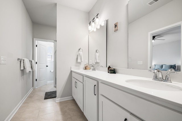 582 Mclernon Trce, Johns Island, SC 29455 - full bathroom with double vanity, tile patterned floors, baseboards, a ceiling fan, and connected bathroom