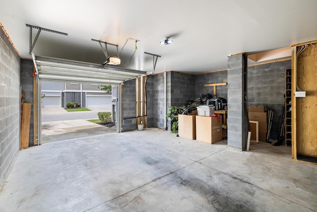 582 Mclernon Trce, Johns Island, SC 29455 - garage featuring concrete block wall and a garage door opener