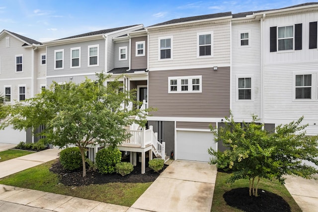 582 Mclernon Trce, Johns Island, SC 29455 - view of front facade with concrete driveway and an attached garage