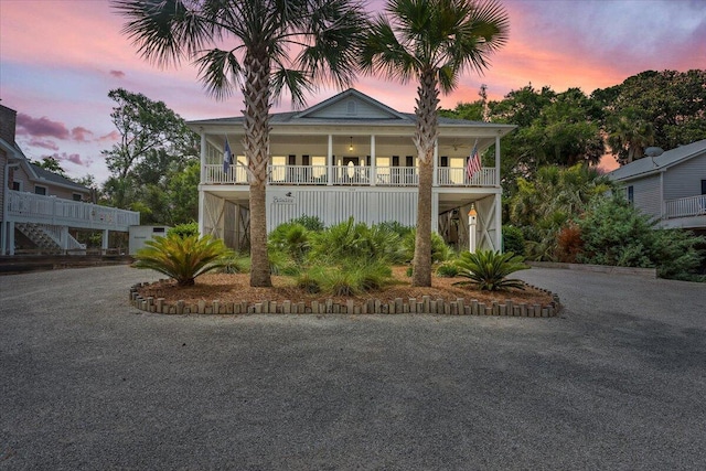 1604 Jungle Rd, Edisto Island, SC 29438 - beach home featuring covered porch, asphalt driveway, and stairs