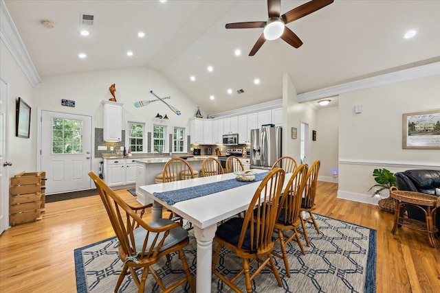 1604 Jungle Rd, Edisto Island, SC 29438 - dining space featuring ceiling fan, light wood-style flooring, crown molding, recessed lighting, and high vaulted ceiling