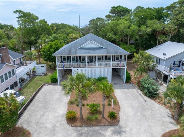 1604 Jungle Rd, Edisto Island, SC 29438 - beach home with driveway, a carport, and covered porch