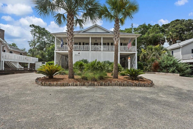 1604 Jungle Rd, Edisto Island, SC 29438 - view of front of home featuring driveway, a carport, a porch, and stairway